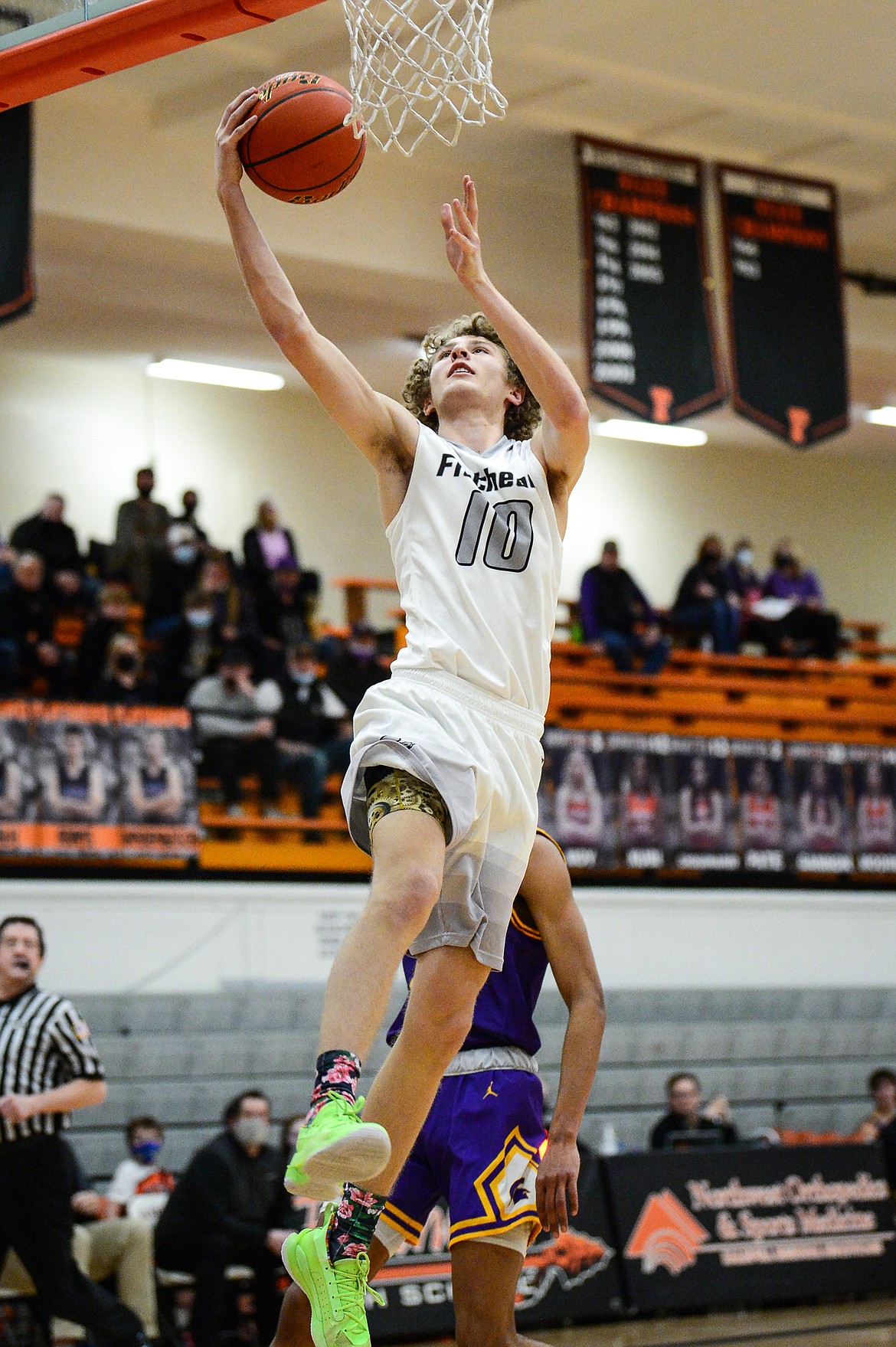 Flathead's Hunter Hickey (10) takes the ball to the hoop against  Missoula Sentinel at Flathead High School on Saturday. (Casey Kreider/Daily Inter Lake)