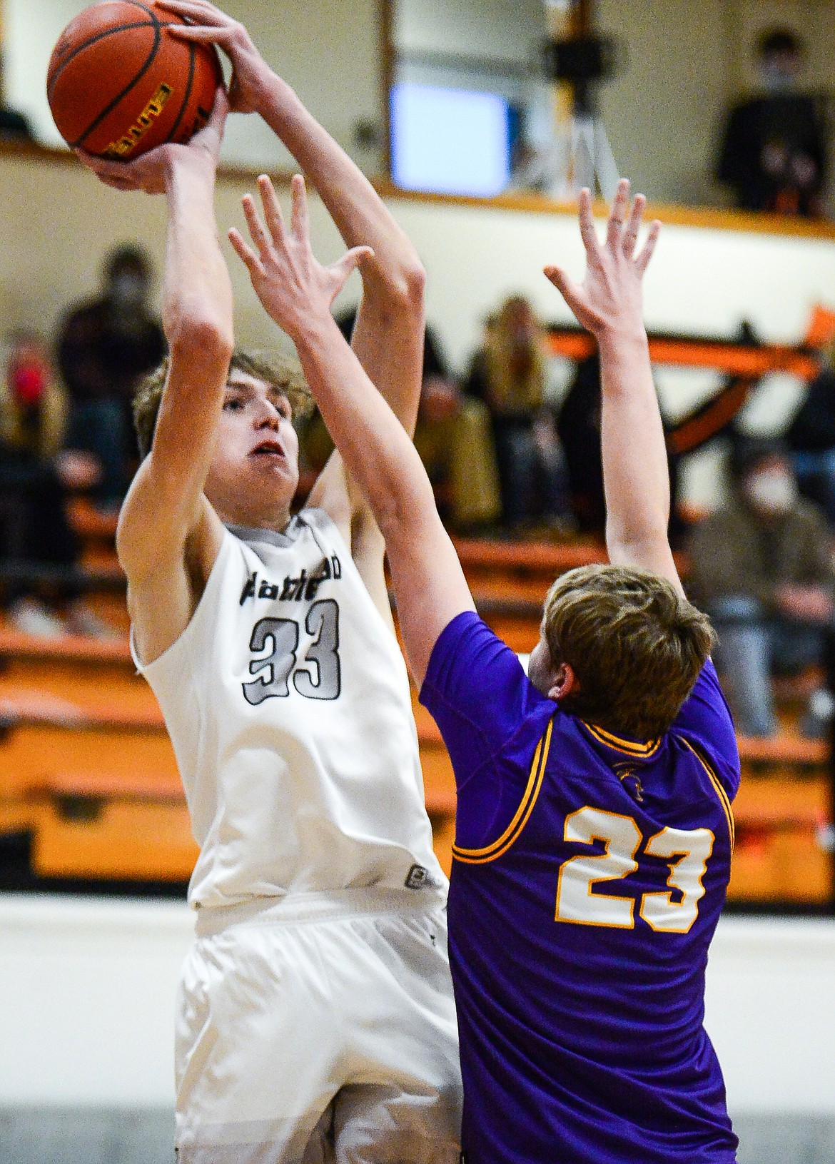 Flathead's Ezra Epperly (33) shoots over Missoula Sentinel's Hayden Kolb (23) at Flathead High School on Saturday. (Casey Kreider/Daily Inter Lake)