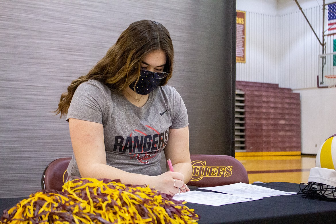 MLHS senior Samantha Shelton makes her signing to Olympic College official on Saturday afternoon at the Chiefs Gym in Moses Lake.