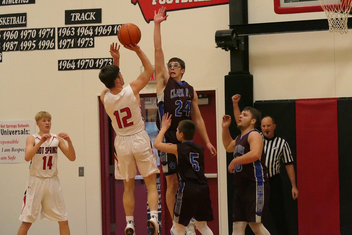 Clark Fork’s Carson Callison (24) defends Hot Springs Kyle Lawson (12) during a recent game. (Clark Fork Valley Press file photo)