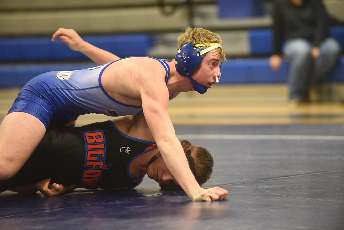 Thompson Falls’ Trae Thilmony has Bigfork’s Eli Tidwell under control during their match last week. Thilmony scored a second-period pin. (Scott Shindledecker/Valley Press)