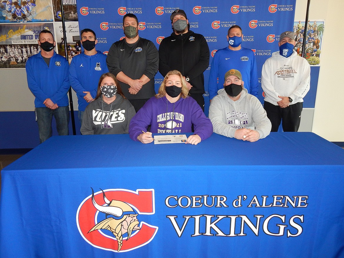 Courtesy photo
Coeur d'Alene High senior Patrick O'Dell recently signed a letter of intent to play football at NAIA College of Idaho in Caldwell. Seated from left are Courtney Beach (mom), Patrick O'Dell and Matt O'Dell (dad); and standing from left, Bill White, Coeur d'Alene High assistant principal; Dustin Shafer, Coeur d'Alene High assistant football coach; Corey Brown, Coeur d'Alene High assistant football coach; Colin Donovan, Coeur d'Alene High assistant football coach; Brian Holgate, Coeur d'Alene High assistant football coach; and Shawn Amos, Coeur d'Alene High head football coach.