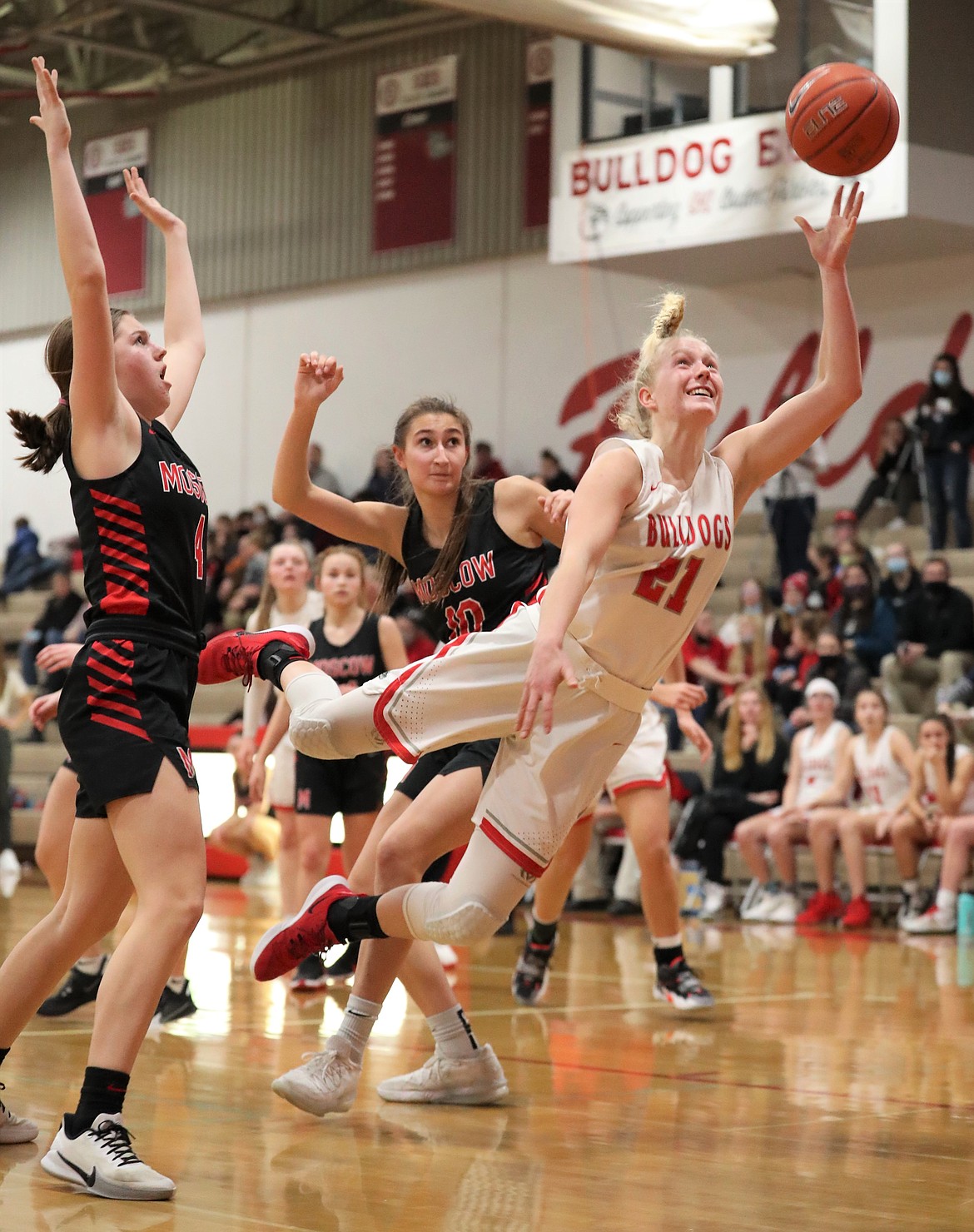 Hattie Larson splits the Moscow defense and attempts a diving layup on Monday.