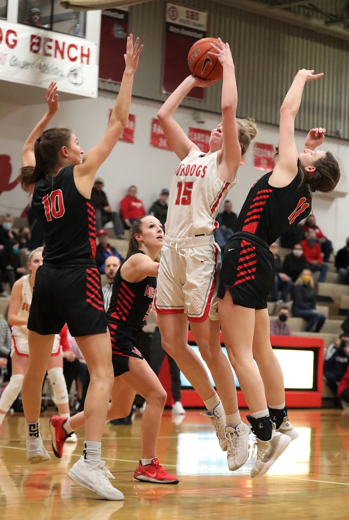 Sophomore Karlie Banks attempts a shot over a swarm of Moscow defenders on Monday.