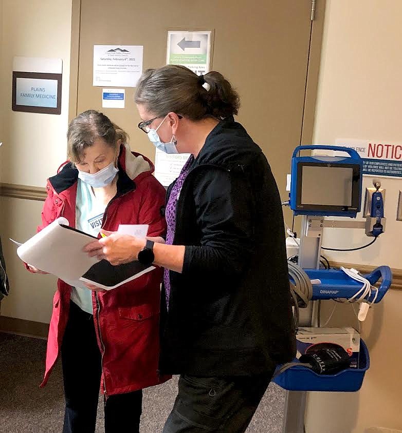 Shelby Zenahlik, BSN, RN assisting Leona Kalafatich from Thompson Falls in the observation area after Kalafatich received her coronavirus vaccine at Clark Fork Valley Hospital. Another woman, Linda Harris Weygint, who recently received her vaccine, had words of praise for how staff members administered the shots. She also said there were no side effects for her or her husband. (Photo courtesy Clark Fork Valley Hospital)