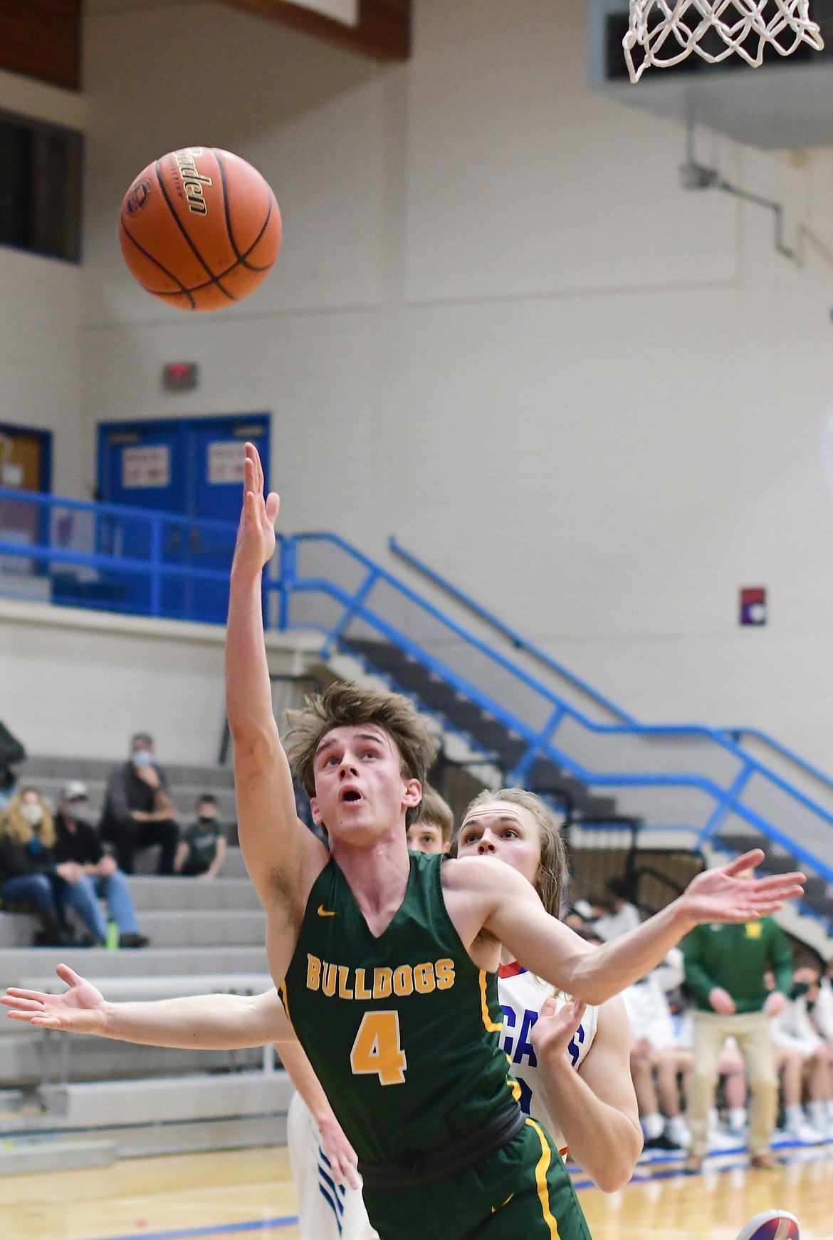 Bodie Smith (4) goes for the layup in a game against Columbia Falls on Friday. (Teresa Byrd/Hungry Horse News)