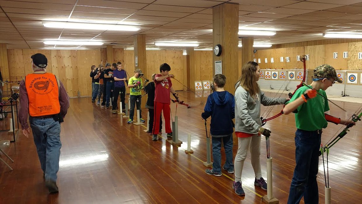 YOUTH ARCHERS prepare to shoot at a Flathead County 4-H Shooting Sports event at the county fairgrounds. (Photo courtesy Flathead County 4-H)