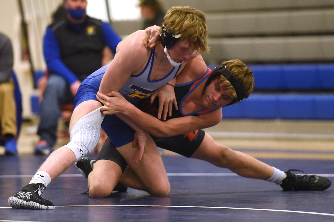 Vaughn Pendlay battles his way to a 15-12 decision over Thompson Falls wrestler Owen Fernstrum last week. (Jeremy Weber/Bigfork Eagle)