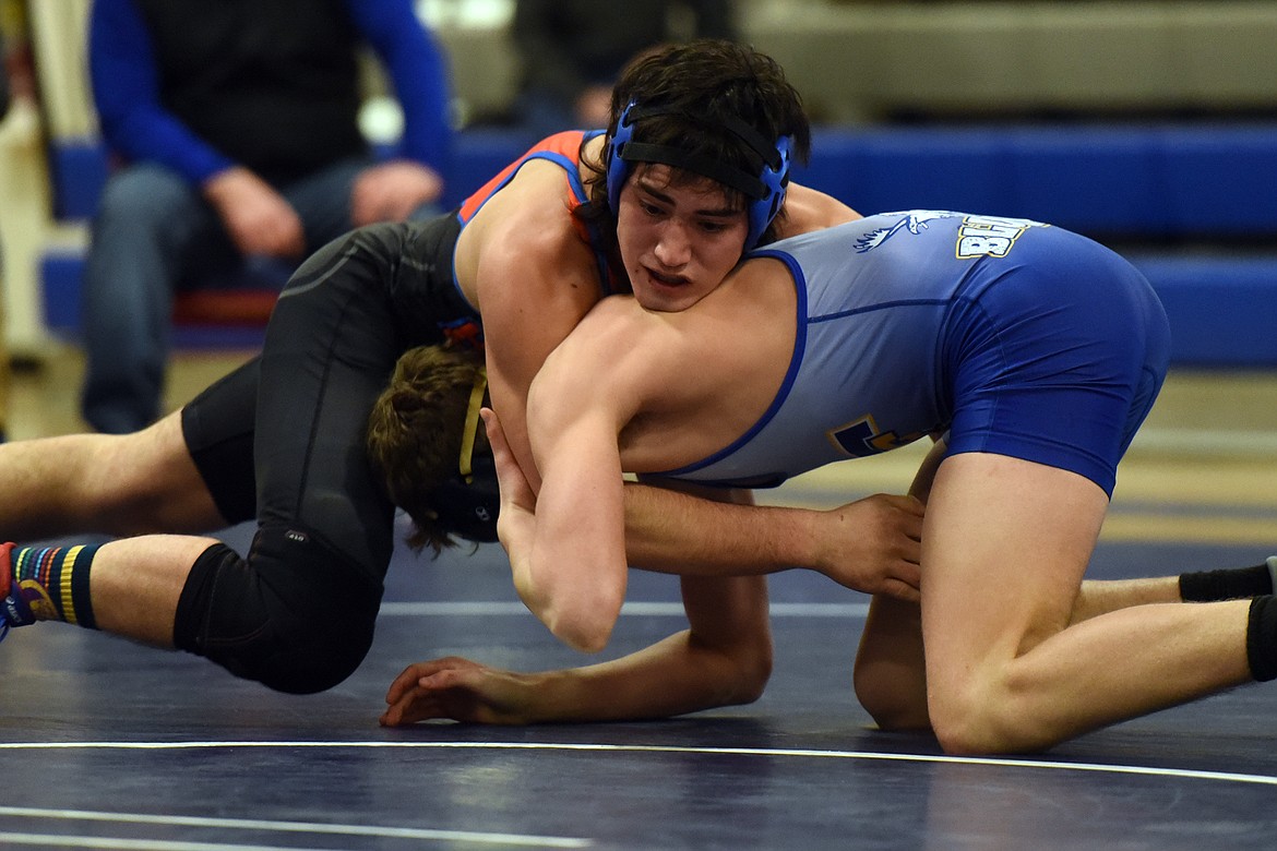 Archie Brevik takes on Thompson Falls wrestler Max Hannum. (Jeremy Weber/Bigfork Eagle