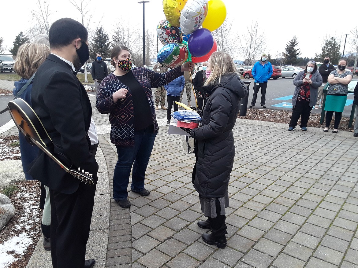 Laura Tenneson delivers a bouquet of balloons to Panhandle Health executive director Lora Whalen Monday outside Panhandle Health. Community organizers collected donations they transformed into gift cards for each of the health district's 167 staff members, as well as its volunteers in the five northernmost counties.