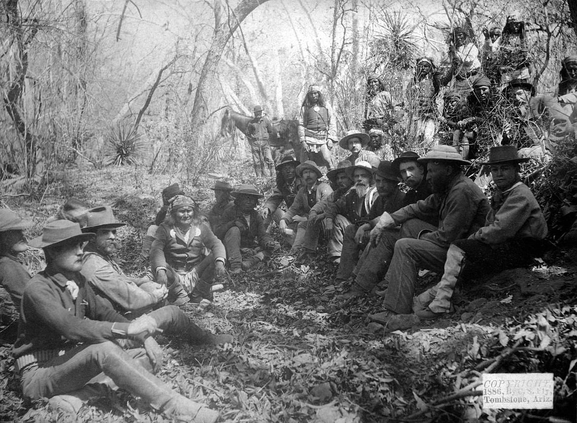 Geronimo poses with members of his Apache band and General George Crook's staff during peace negotiations that failed on March 27, 1886.