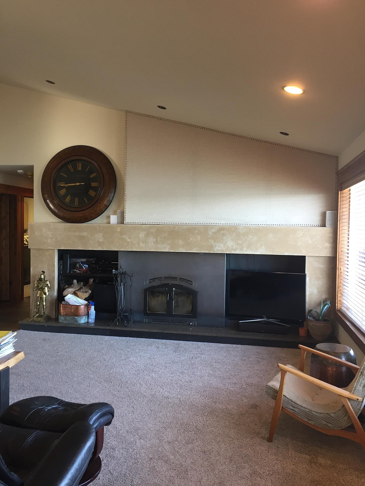 The living room and fireplace area before ...