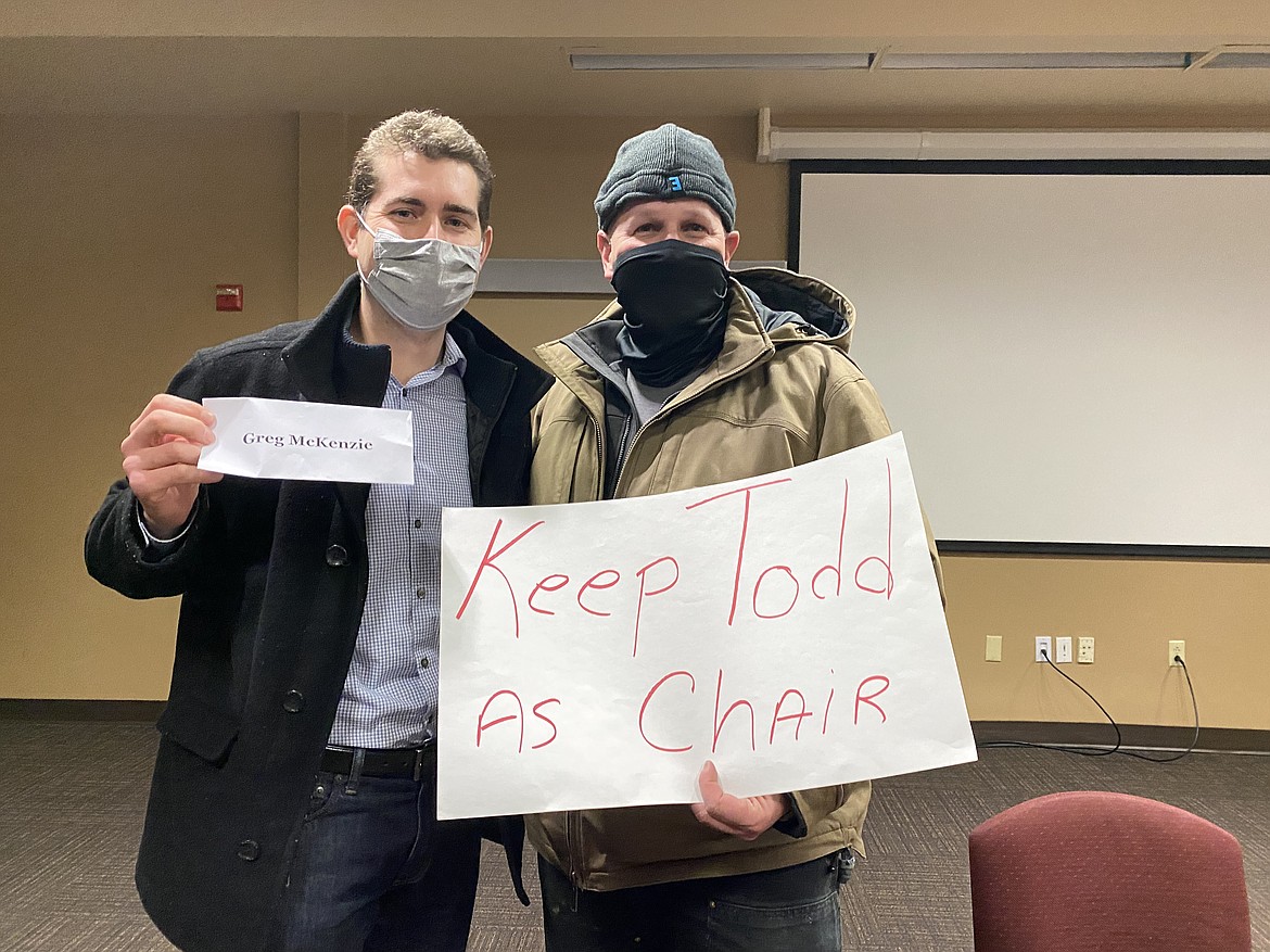 North Idaho College Trustee Greg McKenzie (left) stands with Doug Balija (right) after the special meeting Wednesday night. Both men were happy to "keep Todd" Banducci on the board following weeks of tension. (MADISON HARDY/Press)