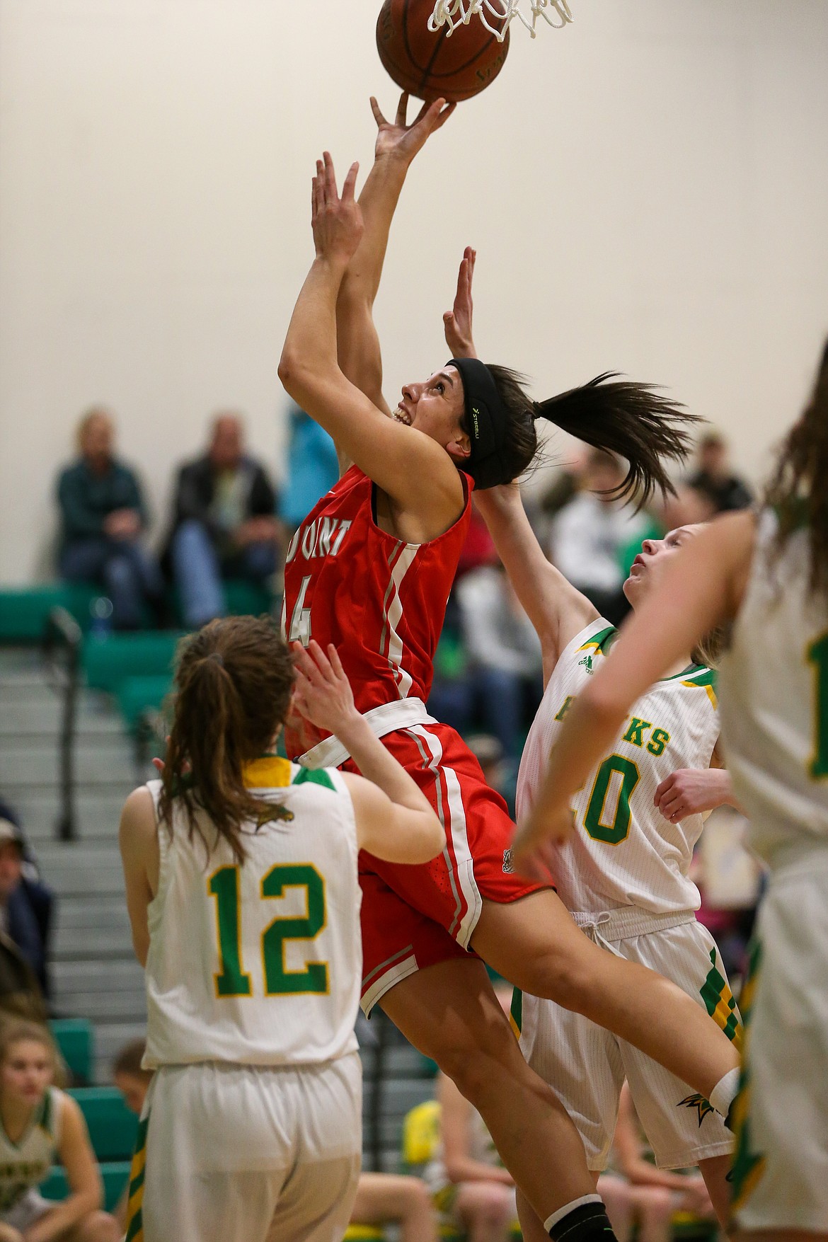 Senior Bella Phillips fights through contact to attempt a shot on Wednesday.