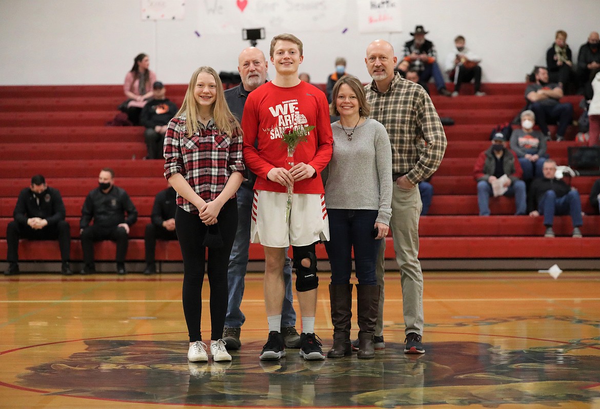 Darren Bailey poses for a photo with his family on Senior Night.