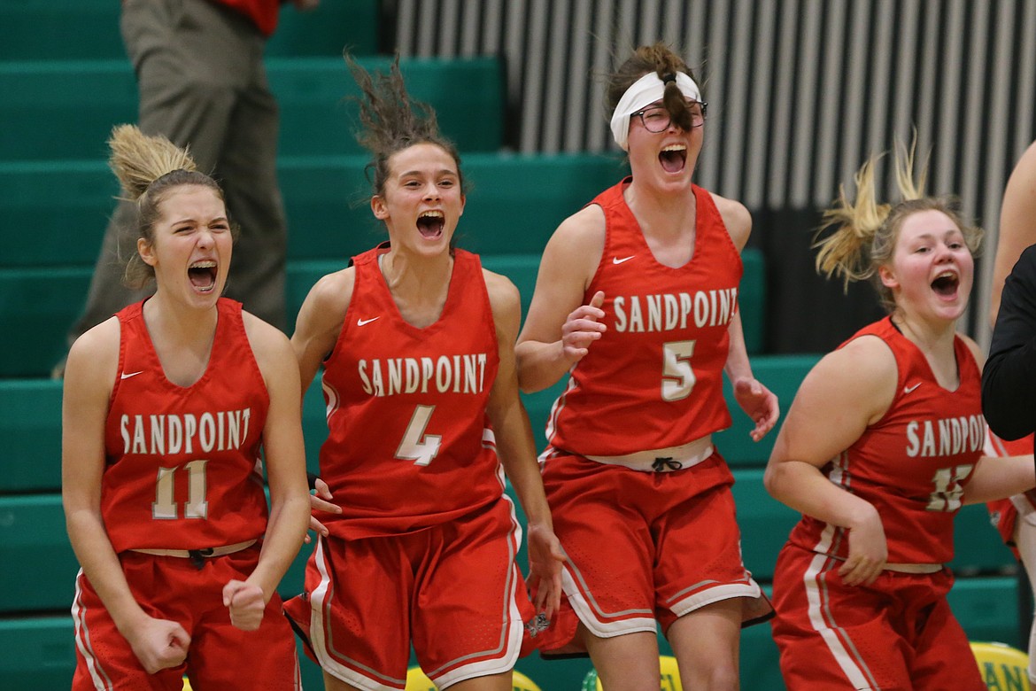 From left: Tru Tomco, Aliya Strock, Anna Reinink and Riley Cessna celebrate after Daylee Driggs hits a free throw to tie the game on Wednesday.