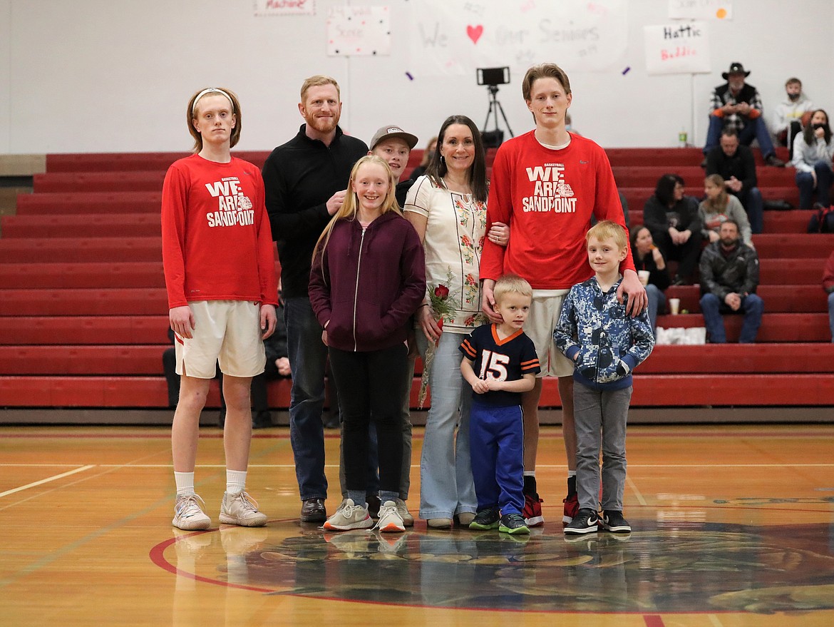 Stone Lee poses for a photo with his family on Senior Night.