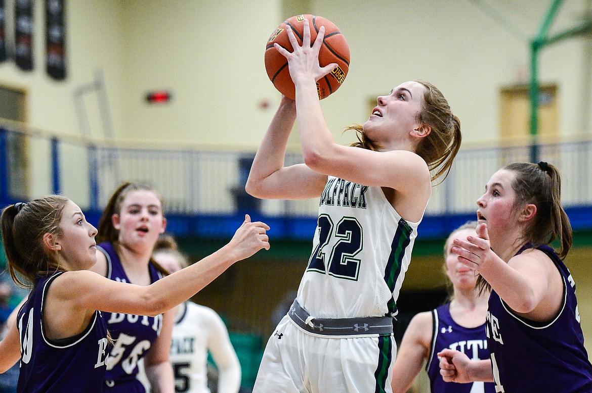 Glacier's Ellie Keller (22) shoots in the lane surrounded by Butte defenders at Glacier High School on Thursday. (Casey Kreider/Daily Inter Lake)