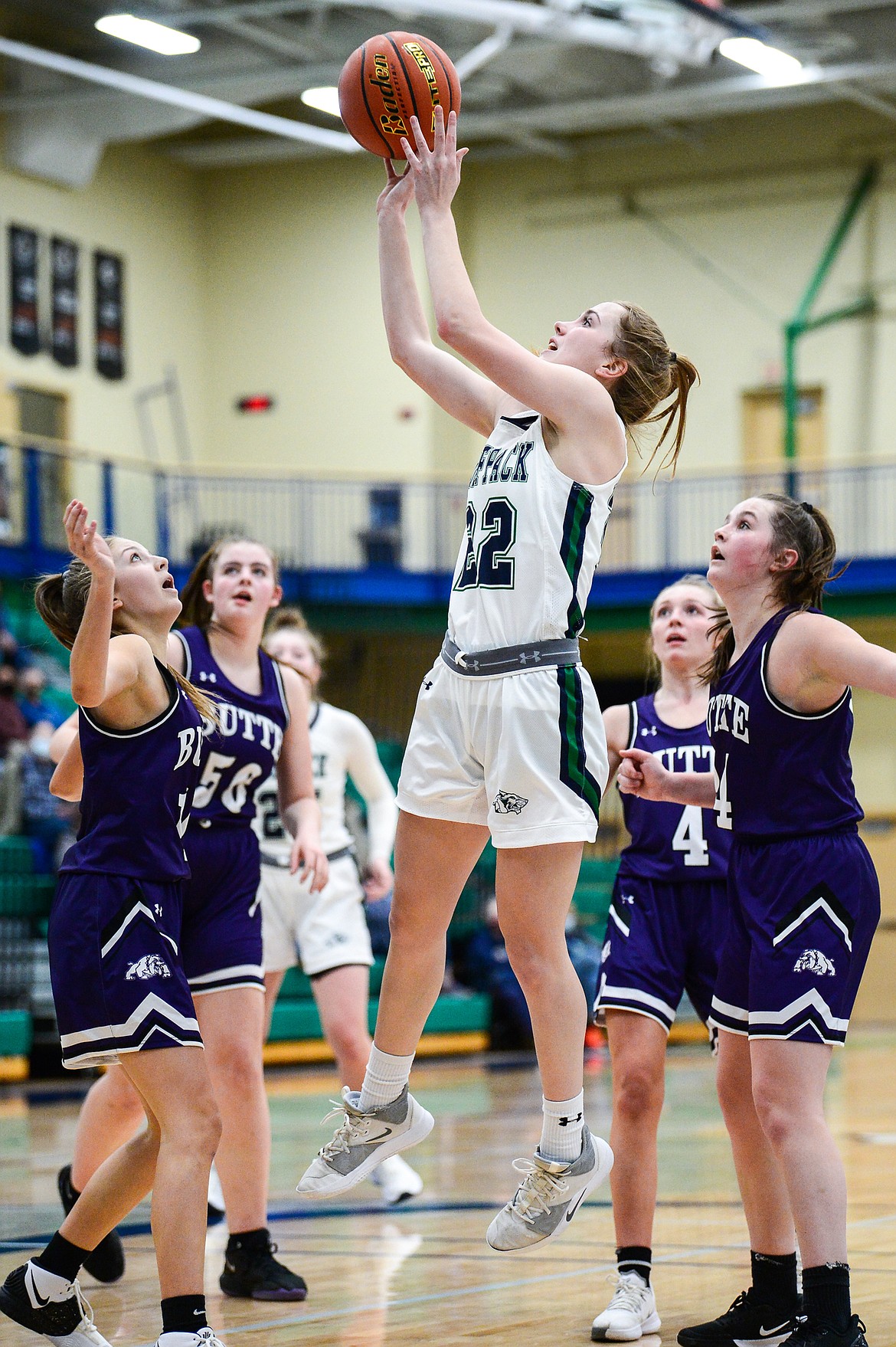 Glacier's Ellie Keller (22) shoots in the lane surrounded by Butte defenders at Glacier High School on Thursday. (Casey Kreider/Daily Inter Lake)