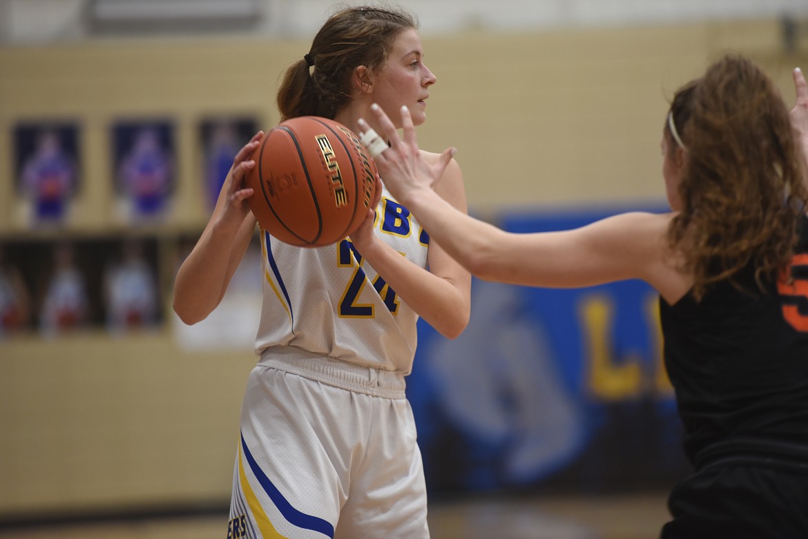 Senior Elise Erickson looks for the pass during the Lady Loggers Feb. 9 game against Eureka. (Will Langhorne/The Western News)