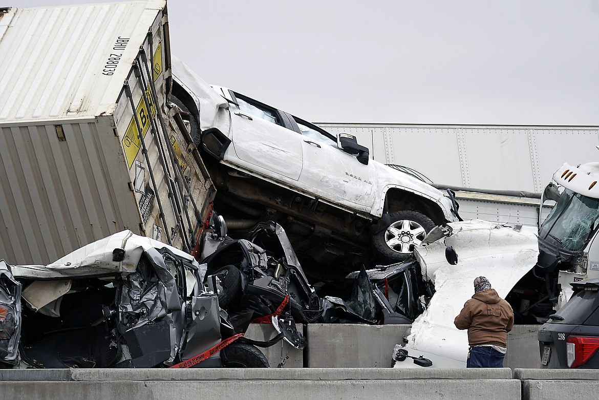 Vehicles are piled up after a fatal crash on Interstate 35 near Fort Worth, Texas on Thursday, Feb. 11, 2021. The massive crash involving 75 to 100 vehicles on an icy Texas interstate killed some and injured others, police said, as a winter storm dropped freezing rain, sleet and snow on parts of the U.S.