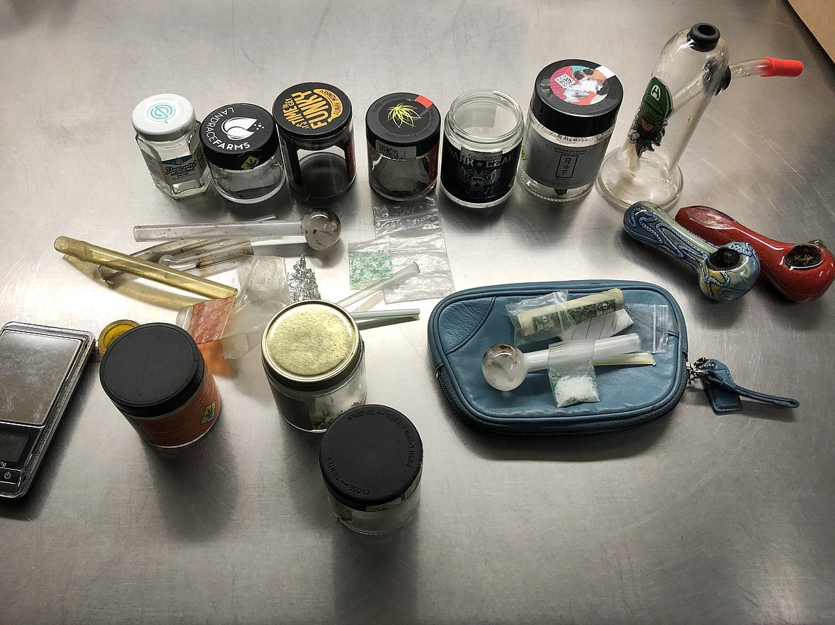 Methamphetamine and miscellaneous marijuana paraphernalia seized during the operation.