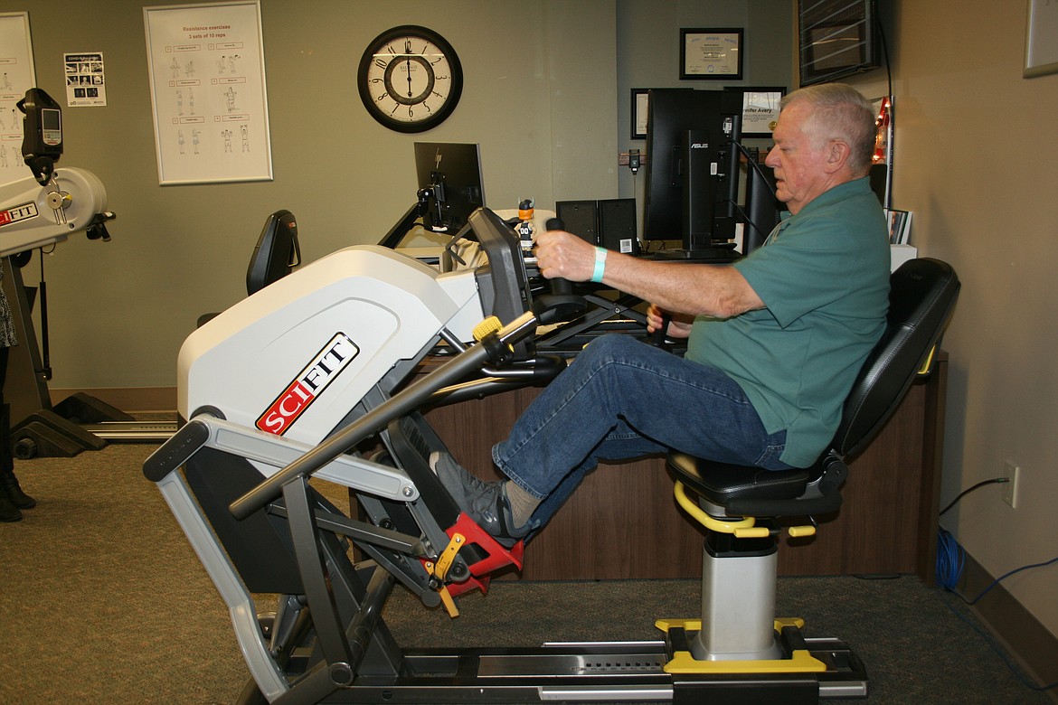 David Hofheins exercises leg muscles during a class at the cardiac rehabilitation program at Samaritan Hospital.