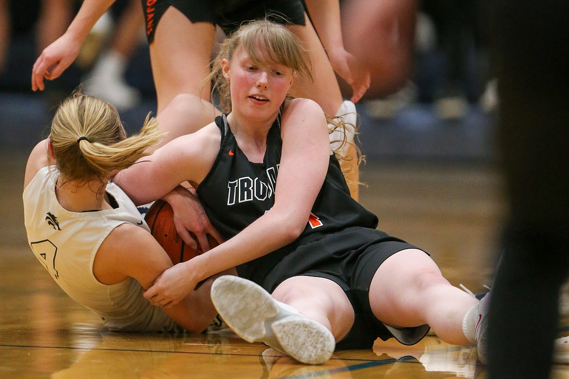 JASON DUCHOW PHOTOGRAPHY
Hanna Christensen, right, of Post Falls, and Sophia Zufelt (4) of Lake City battle for a loose ball Thursday night at Lake City.