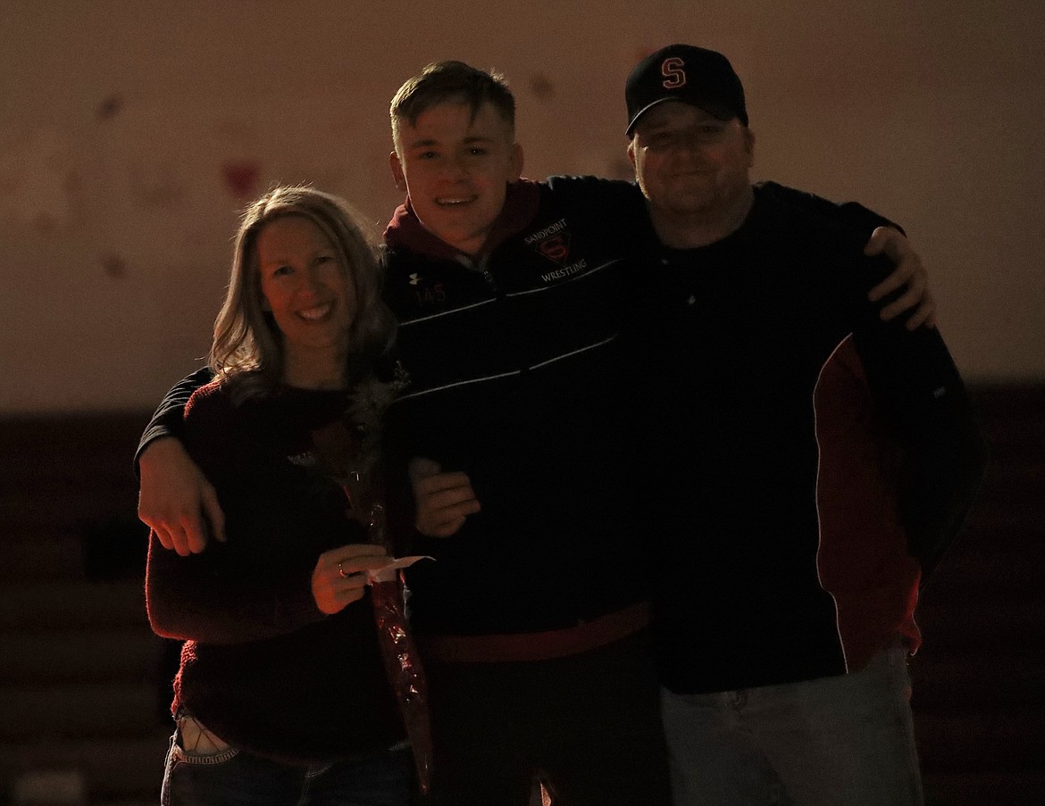 Trevan Adam celebrates Senior Night with his family.