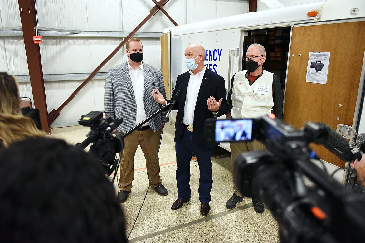 Gov. Greg Gianforte answers questions from the media with Joe Russell, right, Flathead County Health Officer, and Ryan Pitts, left, Chief Nursing Officer and Incident Commander of COVID-19 Response for Kalispell Regional Healthcare, during a tour of a COVID-19 vaccine clinic at the Flathead County Fairgrounds in Kalispell on Friday, Feb. 12. (Casey Kreider/Daily Inter Lake)