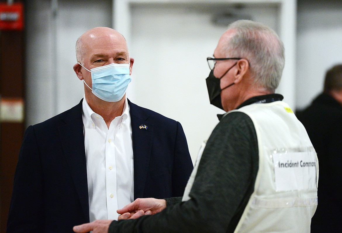 Gov. Greg Gianforte speaks with Flathead County Health Officer Joe Russell during the governor’s tour of a COVID-19 vaccine clinic at the Flathead County Fairgrounds in Kalispell on Friday, Feb. 12. (Casey Kreider/Daily Inter Lake)