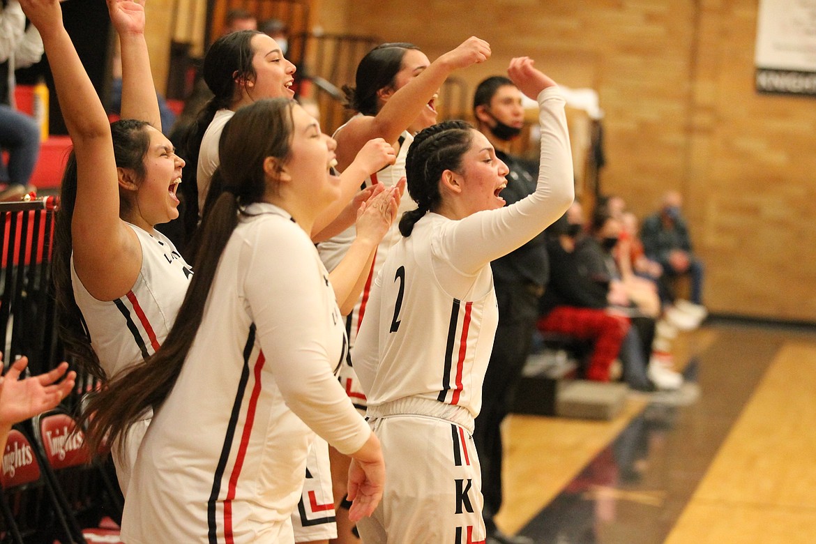 JASON ELLIOTT/Press
Lakeside girls basketball players Ashlee Holt, Jolissa Holt, Kria Peters,, Arianna Gorr and Katannah Marchand celebrate in the final seconds after the Knights 65-42 win over the Wallace Miners in the 1A Division I District 1 championship game at Ron Miller Court on Friday.