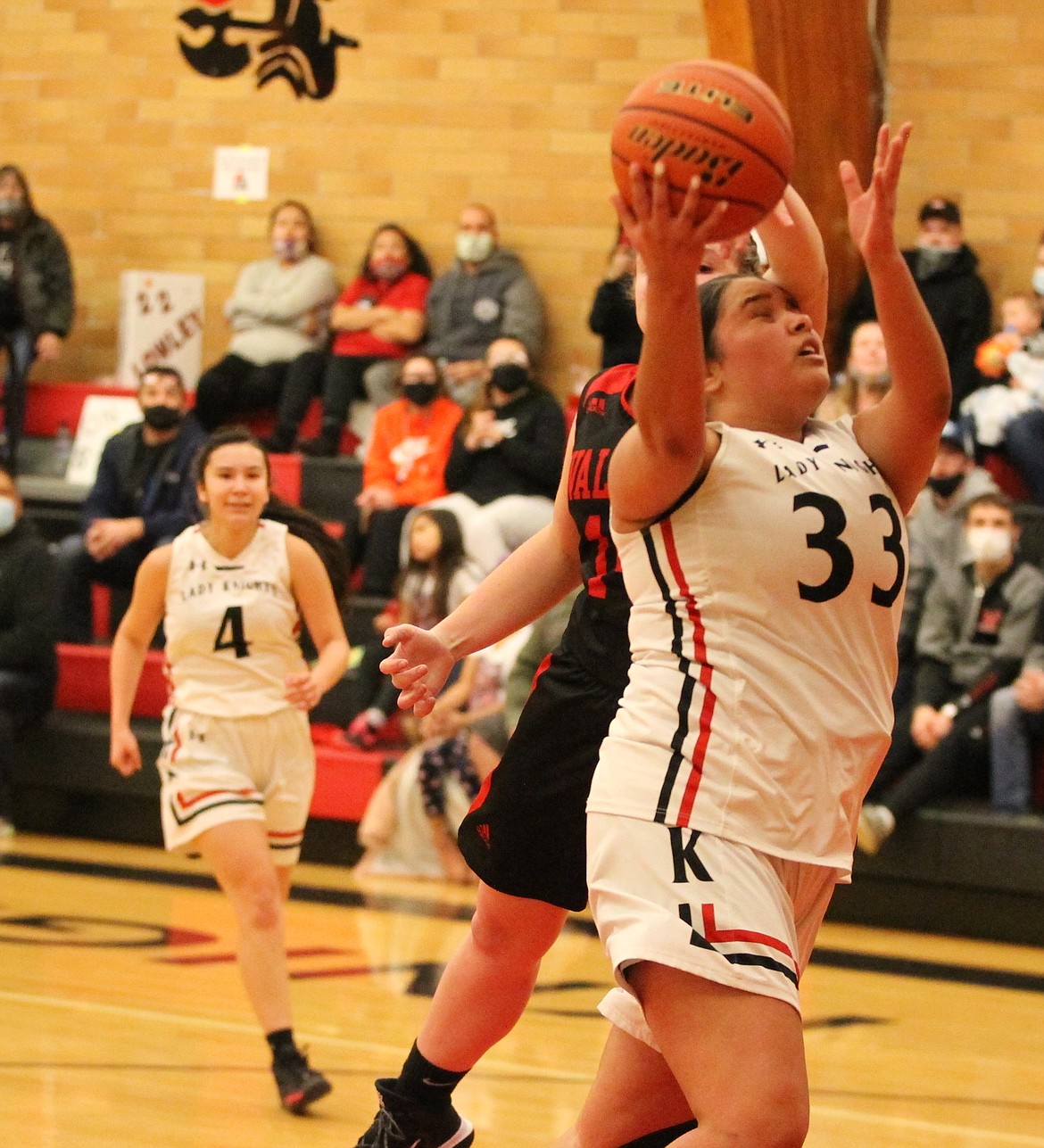 JASON ELLIOTT/Press
Lakeside junior forward Katannah Marchand drives to the basket on Wallace senior Chloe Cielke during the second half of Friday's 1A Division I District 1 championship game at Ron Miller Court.