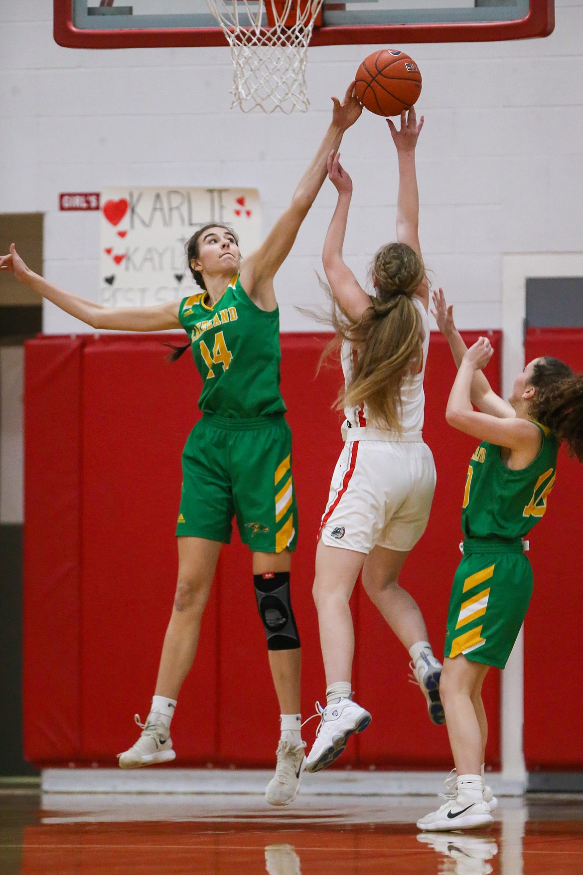 JASON DUCHOW PHOTOGRAPHY
Lakeland's Katy Ryan blocks a shot by Sandpoint's Karlie Banks on Friday night in Game 2 of the best-of-3 4A Region 1 girls basketball championship series in Sandpoint.