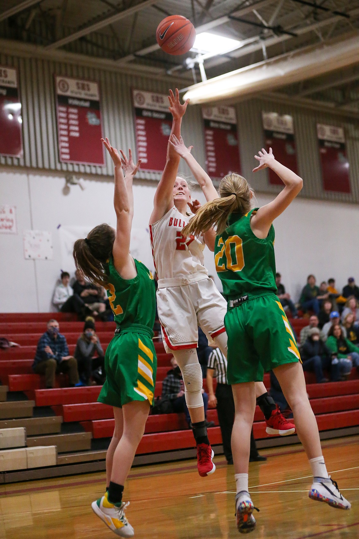 Hattie Larson shoots over a pair of Lakeland defenders on Friday.