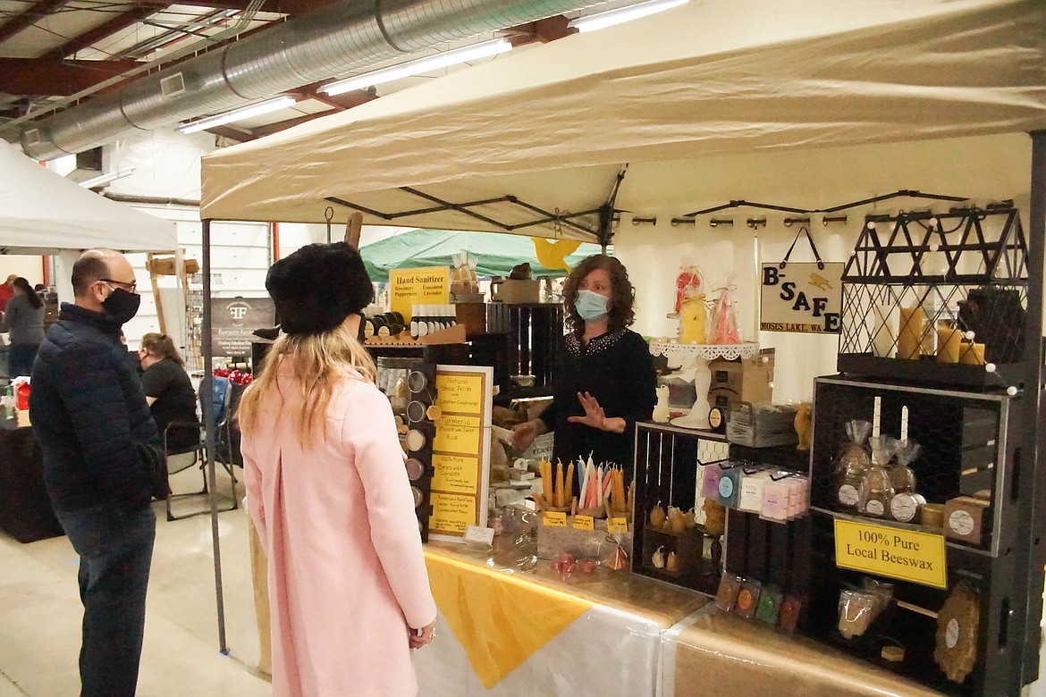 Brenda Herat of B-Safe Products, discusses her different soaps at the spring farmers market on Saturday.