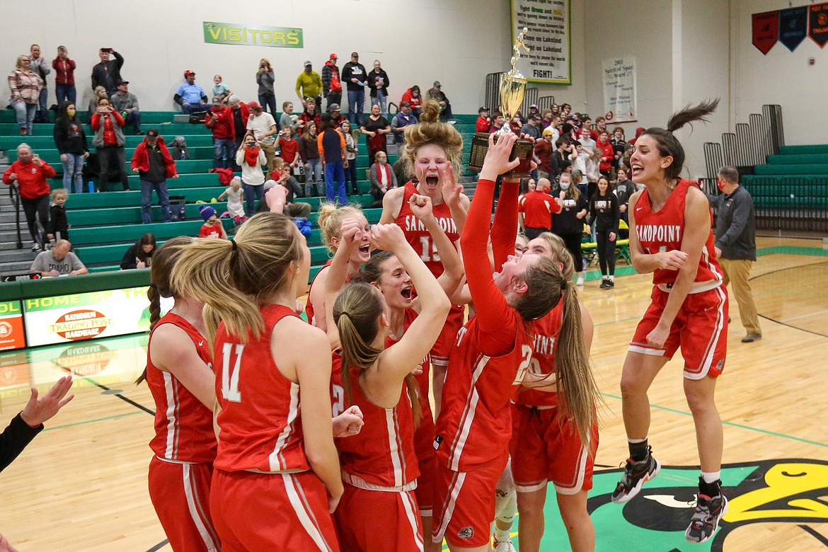 JASON DUCHOW PHOTOGRAPHY
Sandpoint celebrates after beating Lakeland to win the 4A Region 1 girls basketball championship Saturday night in Rathdrum.