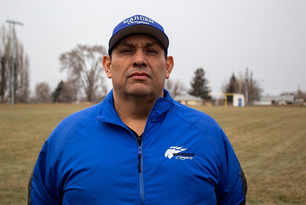 Warden head football coach Robert Arredondo poses for a photo at the high school field on Friday afternoon in Warden.