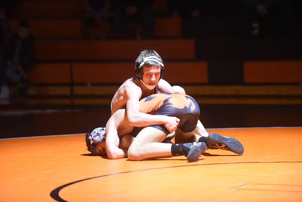 Clark Fork wrestler Decker Milender works against Plains-Hot Springs’ Jacob Schulze last Tuesday in Ronan. Milender eventually got a pin. (Scott Shindledecker/Valley Press)