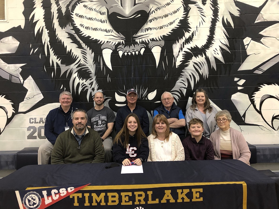 Courtesy photo
Timberlake High senior Izzy Hilliard recently signed a letter of intent to play golf at NAIA Lewis-Clark State College in Lewiston. In the front row from left are Brian Hilliard, father; Izzy Hilliard; Kelli Jo Hilliard, mother; Carter Hilliard, brother and Betty Balison, grandmother; and back row from left, Tim Cronnelly, Timberlake High athletic director; Matt Miller, Timberlake High golf coach; Dennis Saylor, swing coach; Rush Balison, grandfather and Sarah Thweatt, aunt.