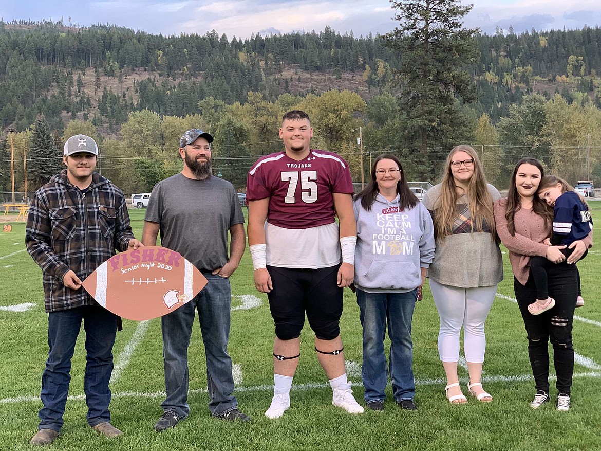 Troy senior Jace Fisher poses with family and friends  has committed to Montana Tech to play defensive tackle and nose guard. (Courtesy photo)