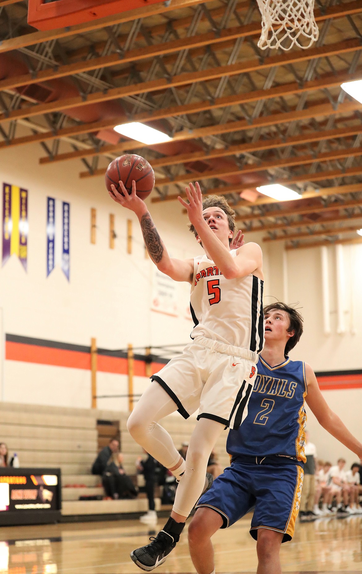 Junior Trentyn Kreager attacks the basket and converts a layup during a game against North Idaho Christian on Jan. 4 at PRLHS.