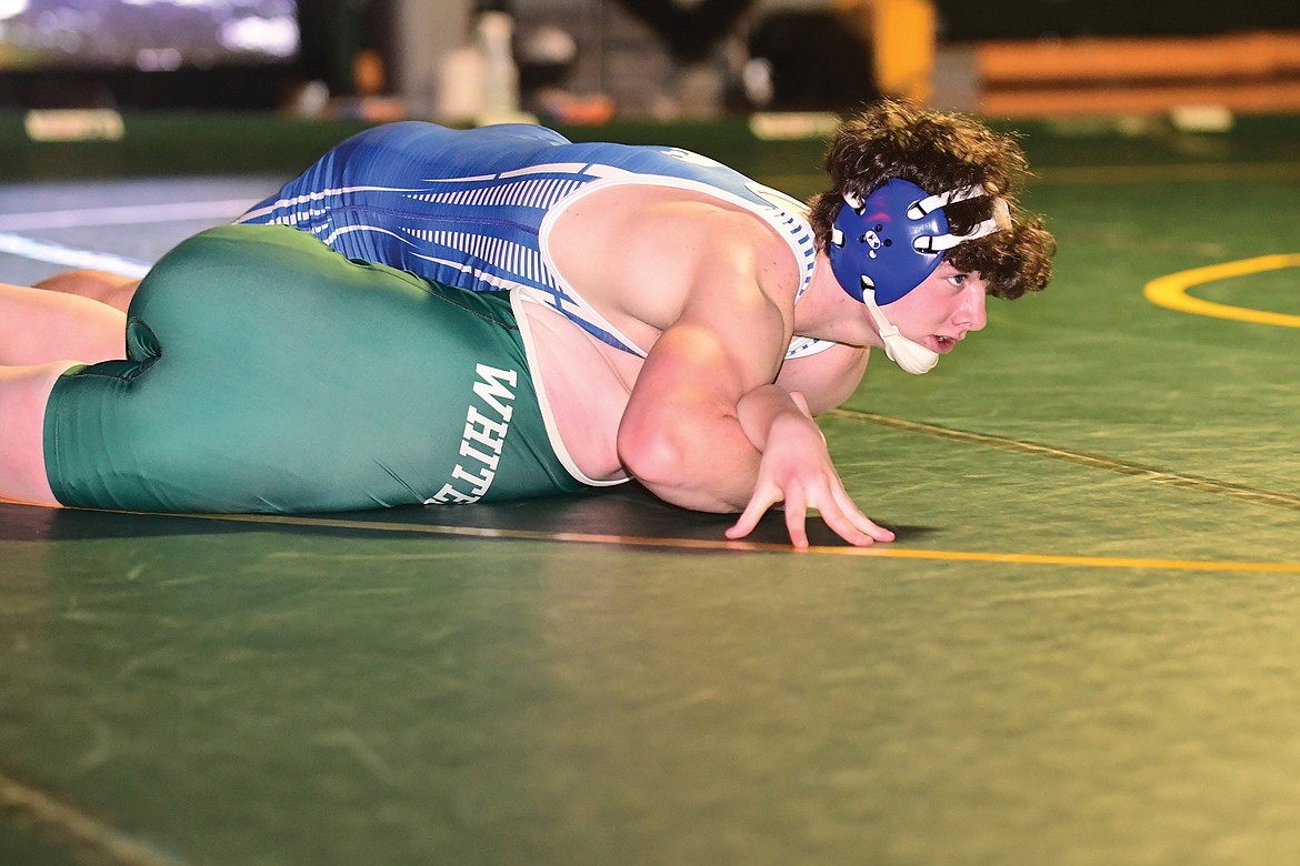 Isaiah Roth looks for the pin to be called in a match against Whitefish's Rylan McDaniel on Saturday. (Teresa Byrd/Hungry Horse News)