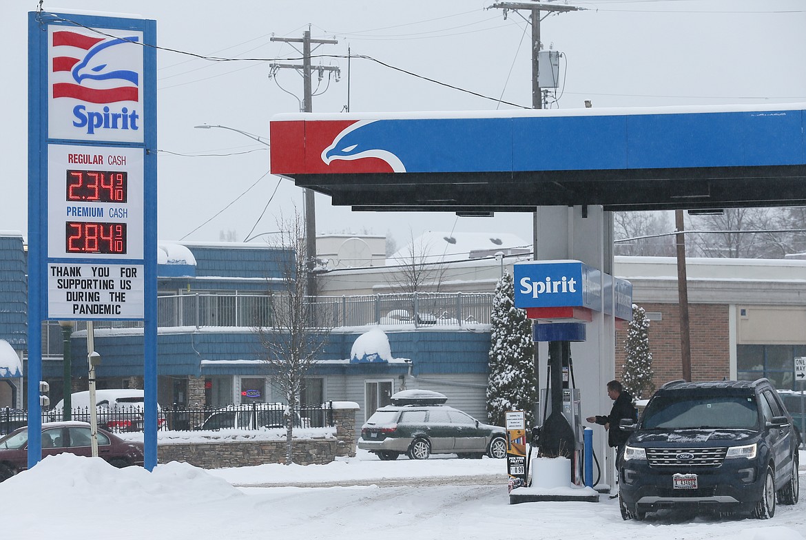 A customer fills up at Prime Gas and Grocery at Sherman Avenue and Seventh Street on Tuesday. According to AAA, Idaho experienced the biggest monthly gas price increase in the U.S. with a 20-cent jump. Coeur d'Alene prices are averaging $2.35 per gallon while Boise is at $2.55 per gallon.