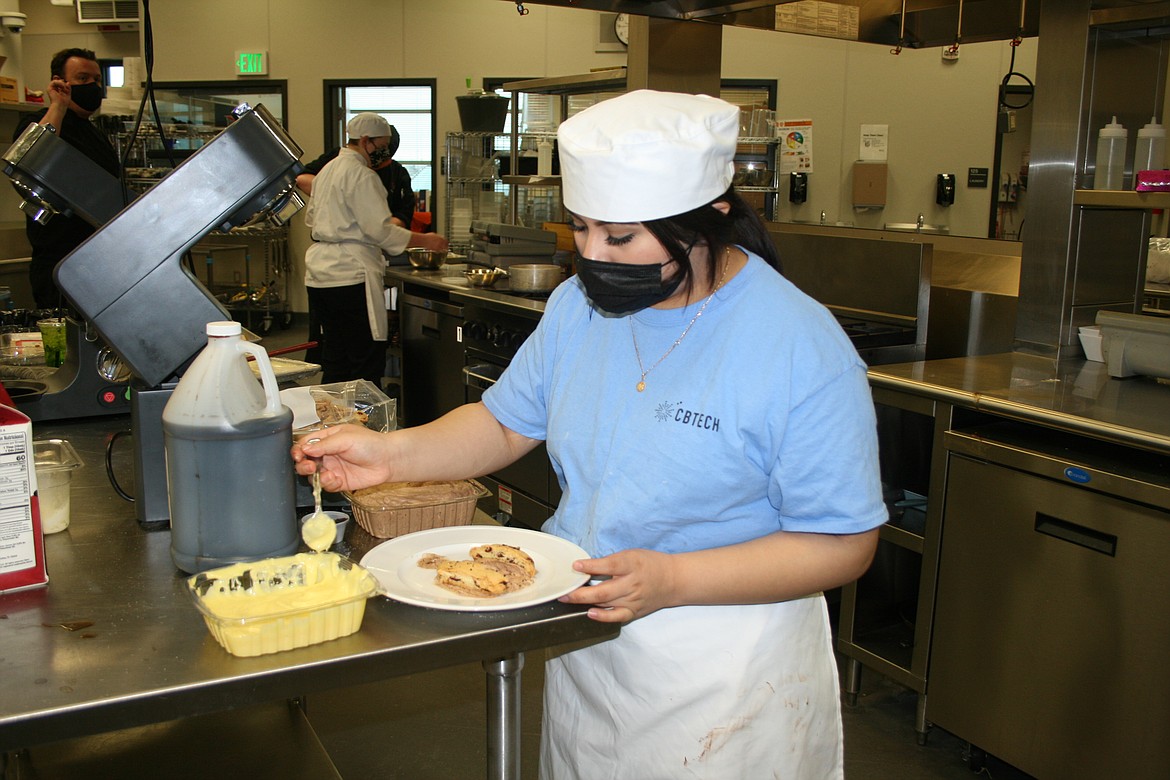 Isabel Duran, Othello High School and Columbia Basin Technical Skills Center culinary student, works for just the right presentation.