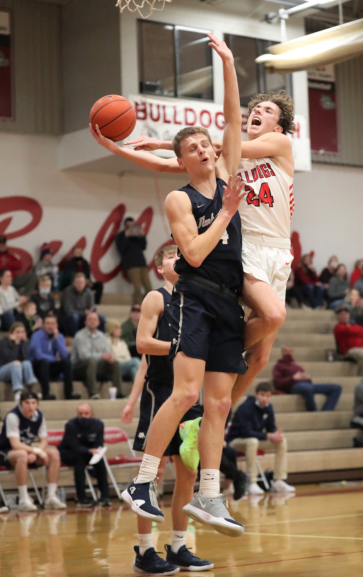 Randy Lane (right) fights through contact to attempt a layup on Tuesday.