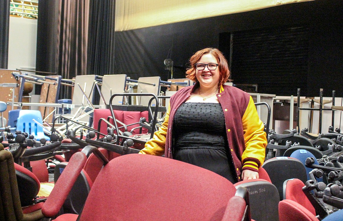 MLHS senior, Thespian Club president, and Drama Club member Ana McCabe stands amid the clutter on the high school theater stage Wednesday.