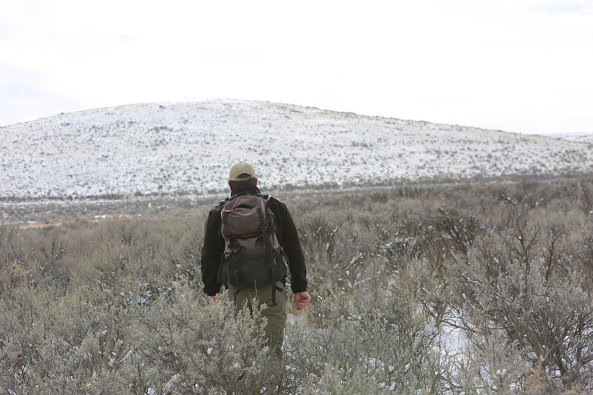 WDFW biologist Jon Gallie hikes through the Beezley Hills Preserve on Tuesday.