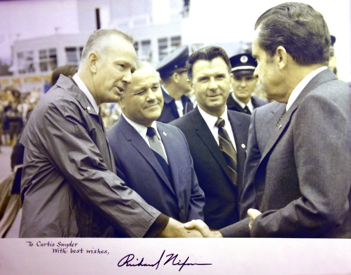 A signed photo of President Richard Nixon shaking hands with Curtis J. Snyder at Glacier International Airport in 1971 hangs on the wall of the former Flathead County Sheriff's home. (Jeremy Weber/Daily Inter Lake)