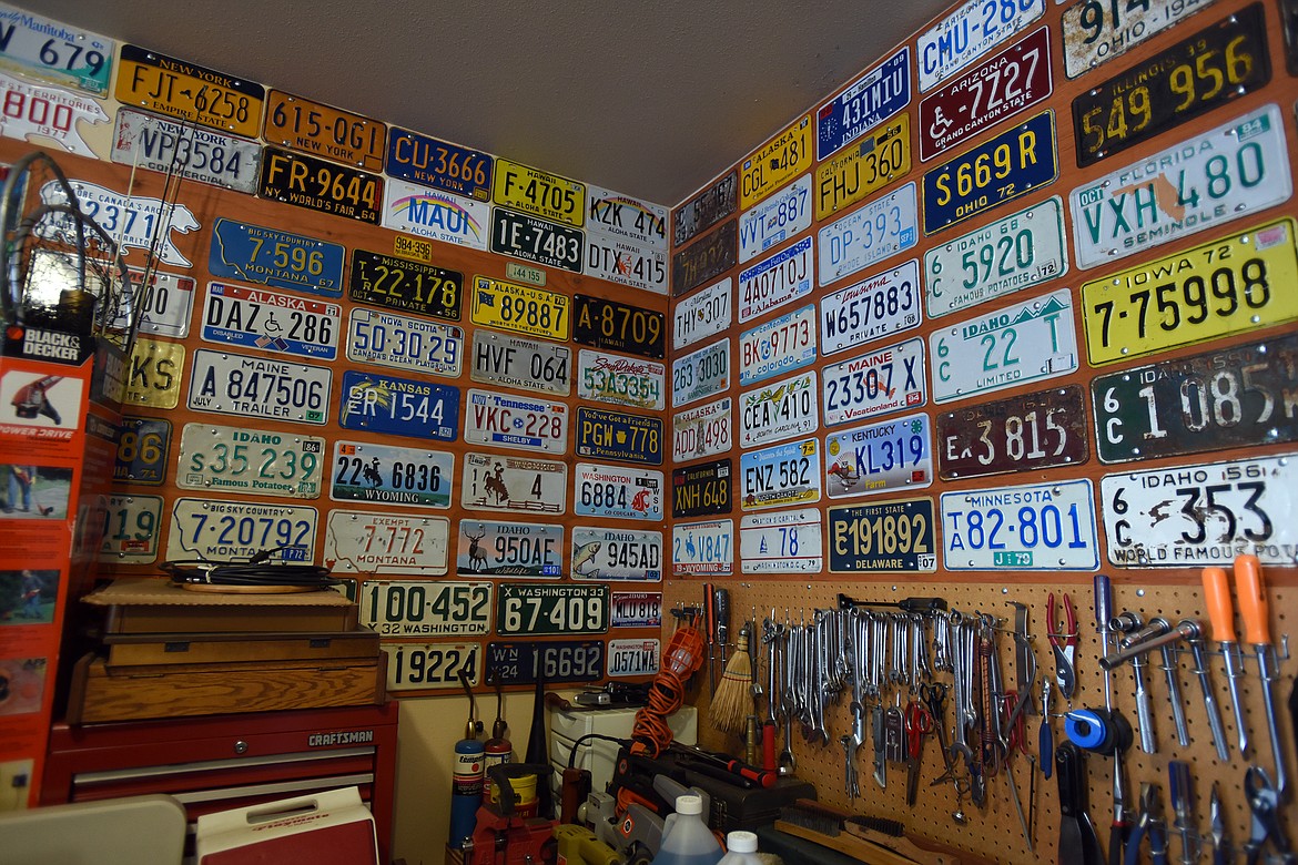 Ken Fitzgerald's collection of more than 3,000 license plates fills his garage in Kalispell. (Jeremy Weber/Daily Inter Lake)